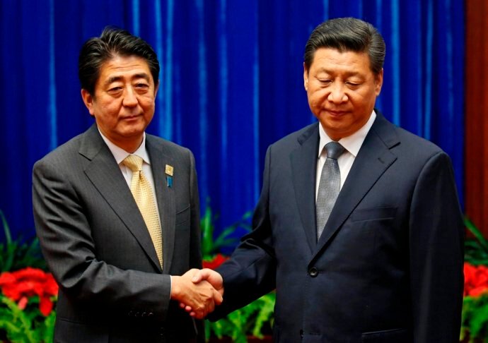 习近平会见安倍时的表情被官方媒体多维度解读